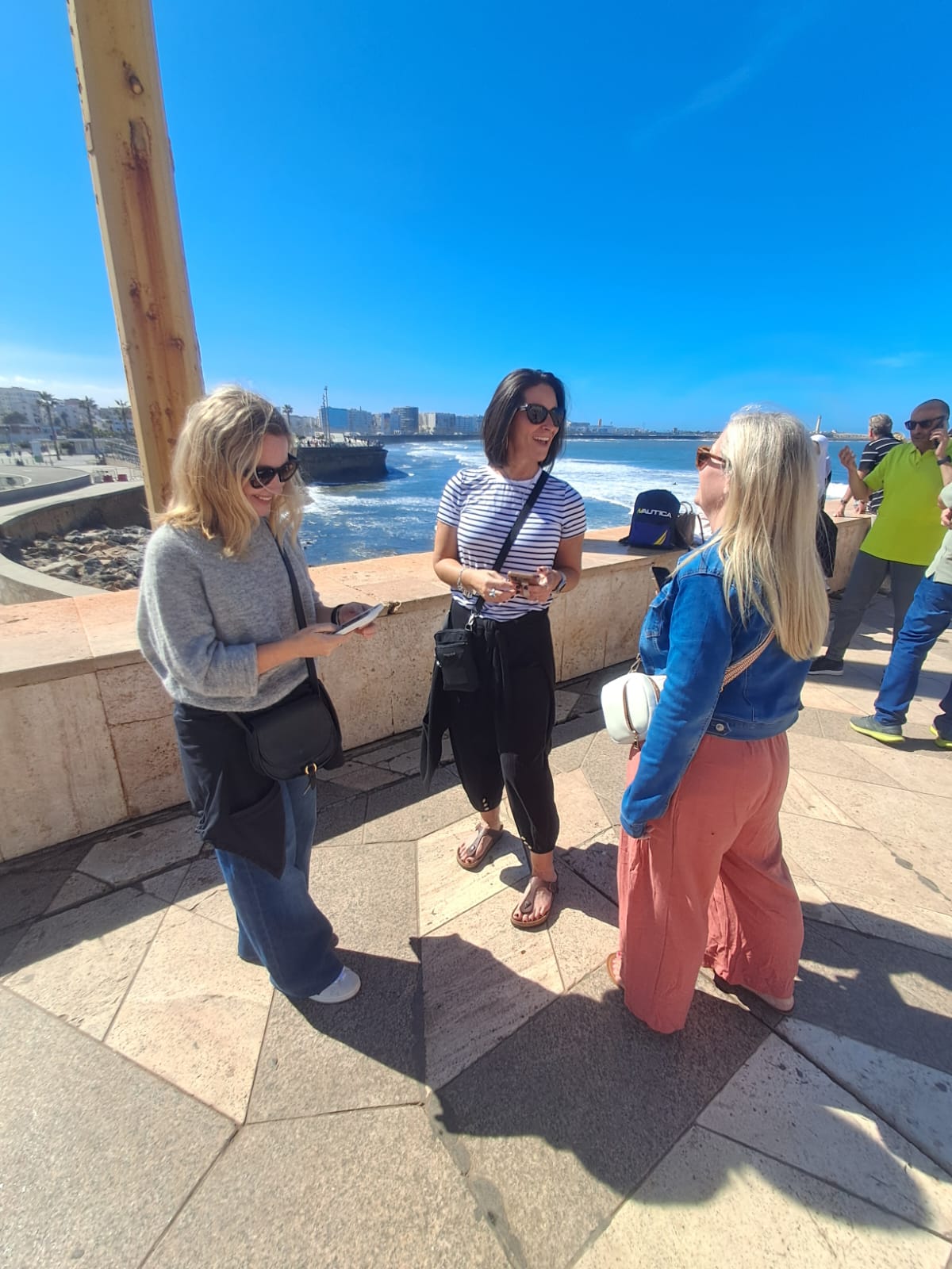 Tourists enjoying the beautiful coastal views of Tangier