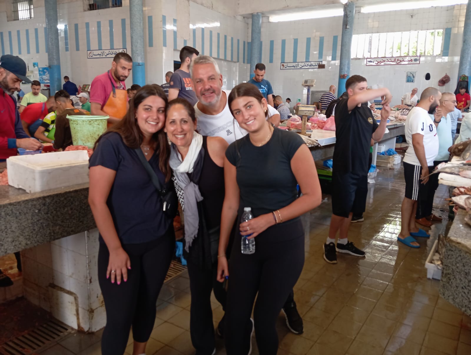 Tourists experiencing a traditional Moroccan fish market