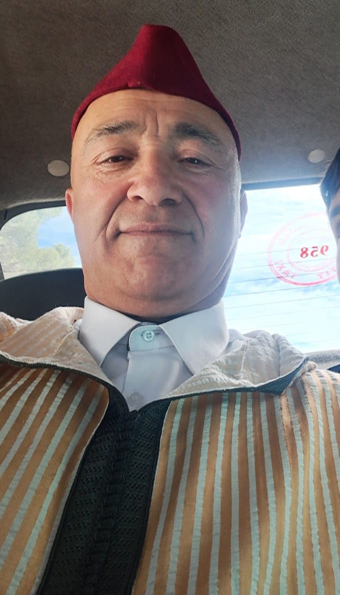 Hamid wearing traditional Moroccan fez