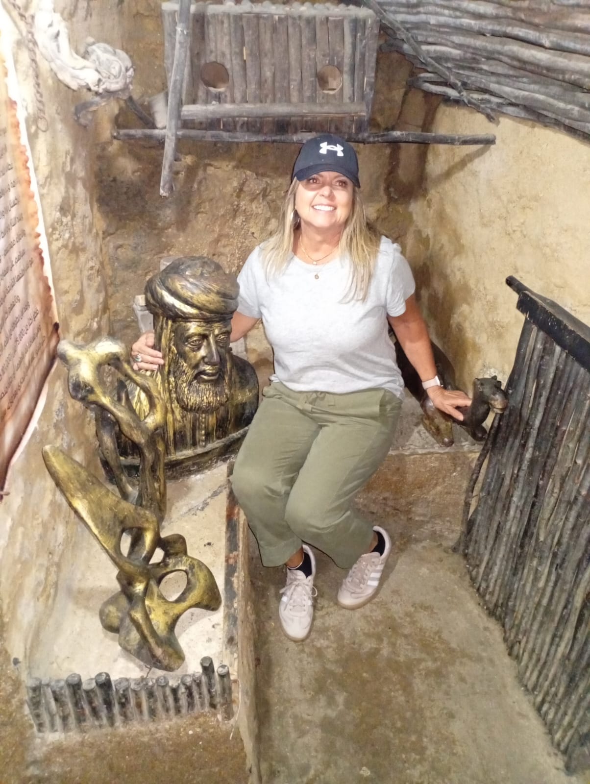 Tourist with traditional Moroccan brass sculpture in a historical site