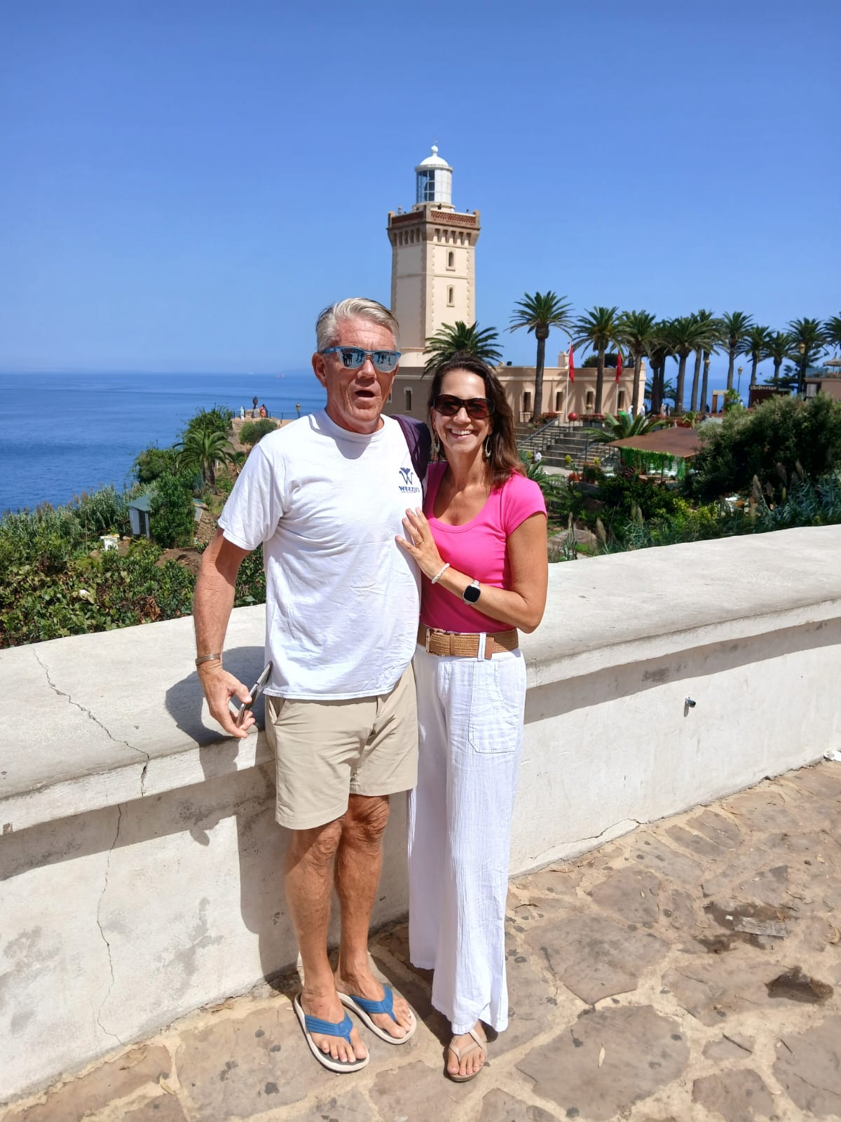 Couple at the famous Cape Spartel lighthouse with ocean views