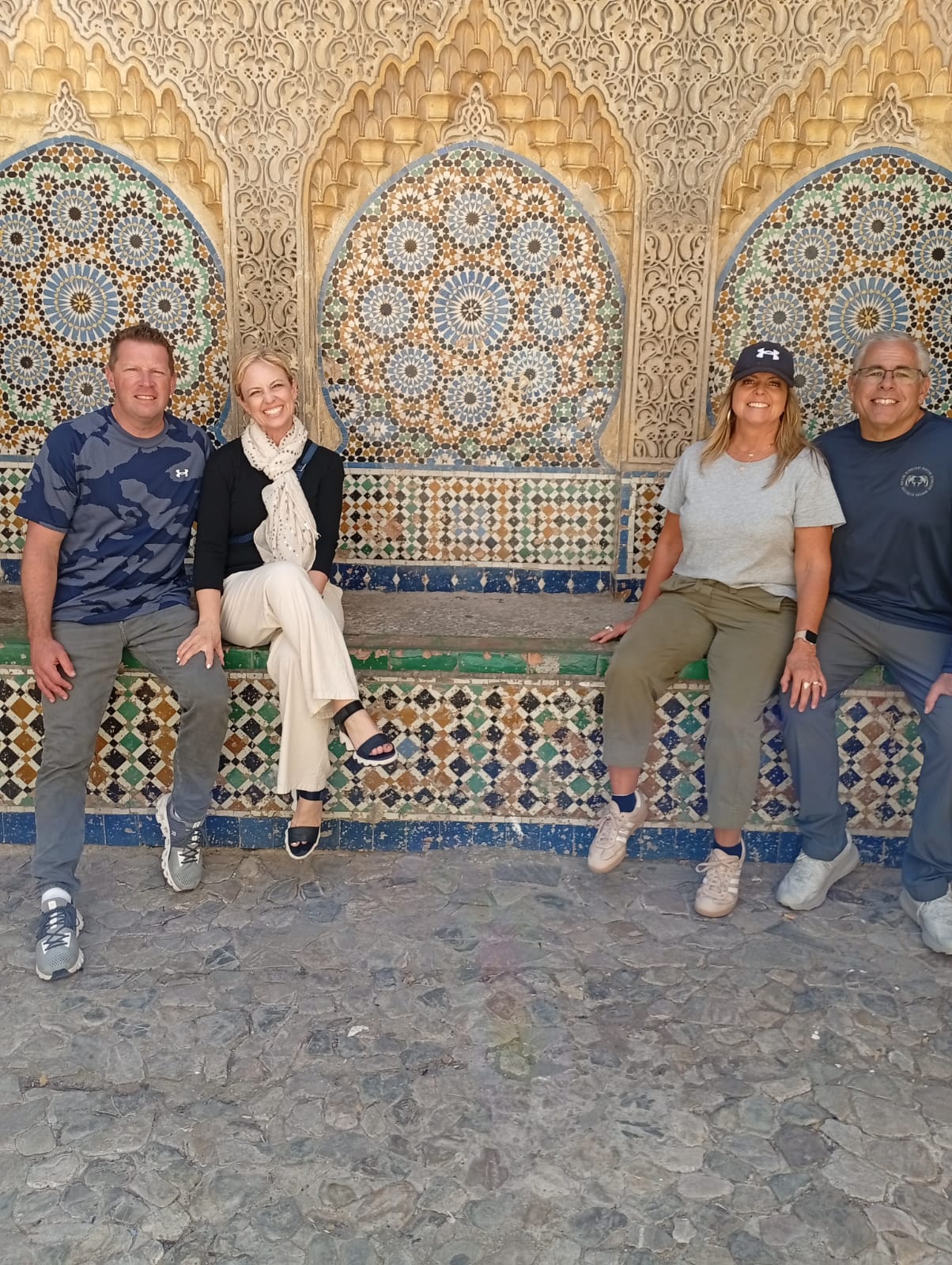 Tourists admiring beautiful Moroccan mosaic tile work