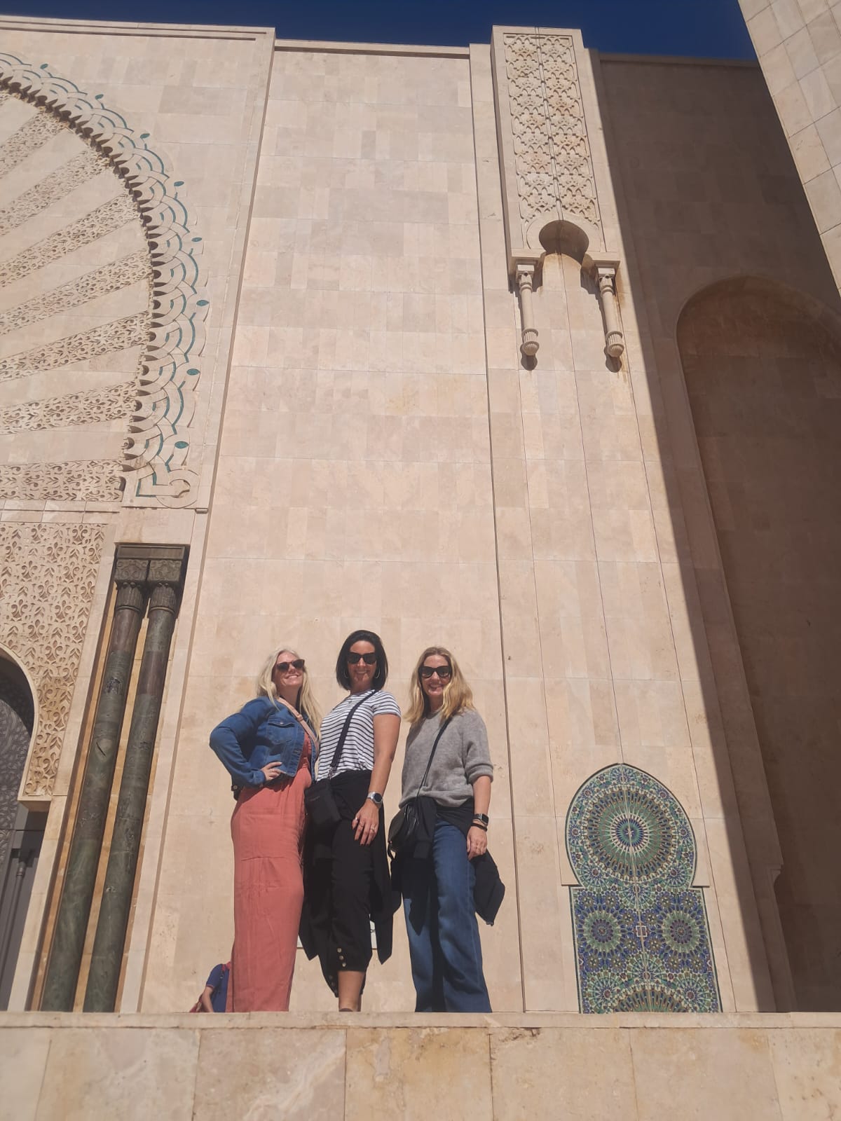 Female tourists visiting a beautiful Moroccan mosque