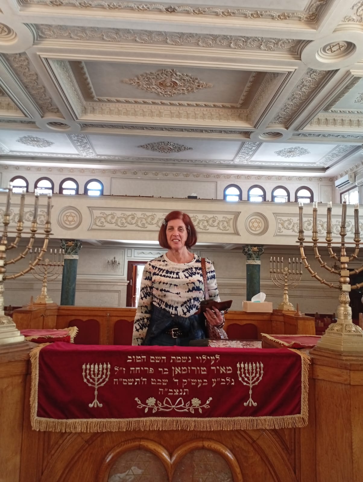 Tourist exploring a historic synagogue in Morocco