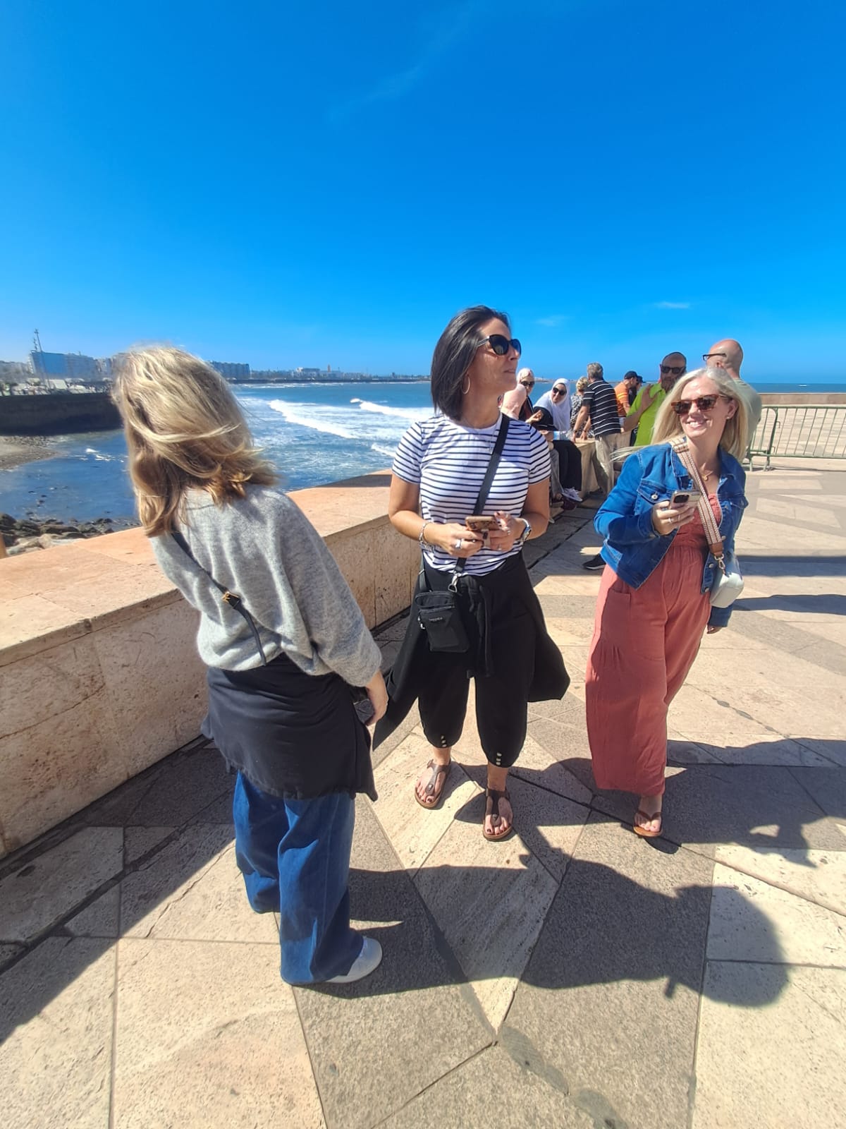 Tourists enjoying the beautiful coastline views of Tangier