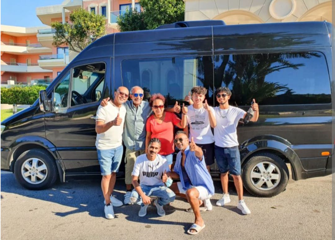 Happy tourists with Hamid's comfortable tour van
