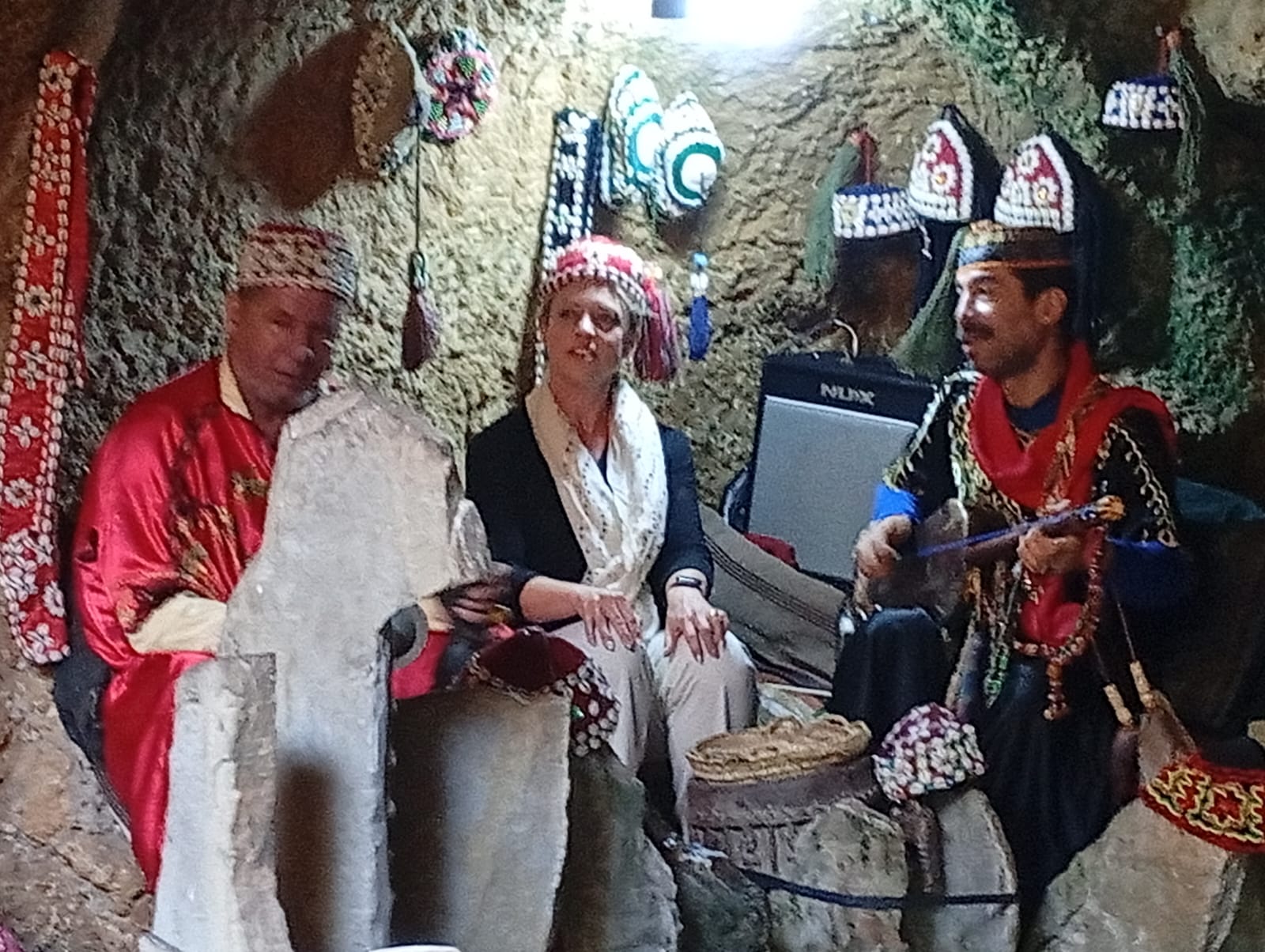 Tourist enjoying traditional Moroccan music and cultural performance