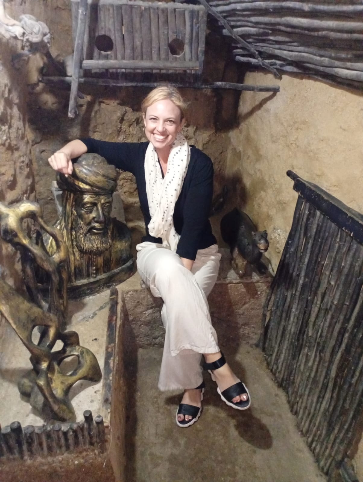 Tourist exploring traditional Moroccan art and sculptures